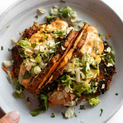 Egg roll tacos on a plate.